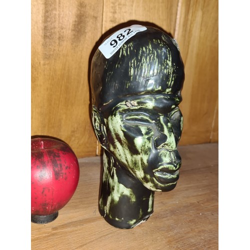 982 - A handsome heavy African ceramic sculpture bust with dark green olive glaze.