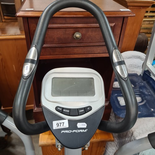 977 - A Pro-form elliptical machine, ideal for low-impact cardio workouts, with digital display and adjust... 