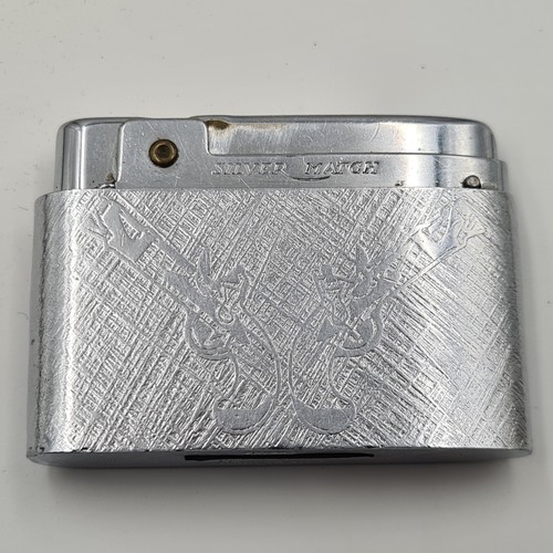 20 - A collection of two gas lighters. The first a boxed (Silver Match) example together with a (Hudson S... 