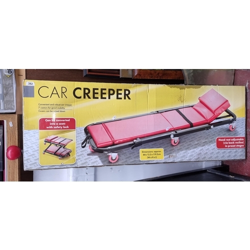 382 - A new in box Car Creeper. Features even castors for mobility and can be converted to seat with safet... 