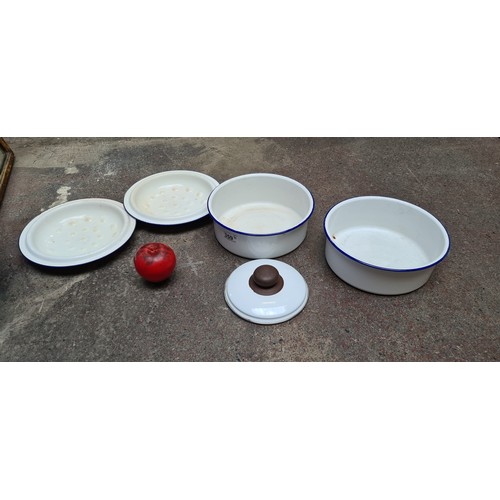 359 - A pair of vintage enamel lidded dishes in a blue and white finish.