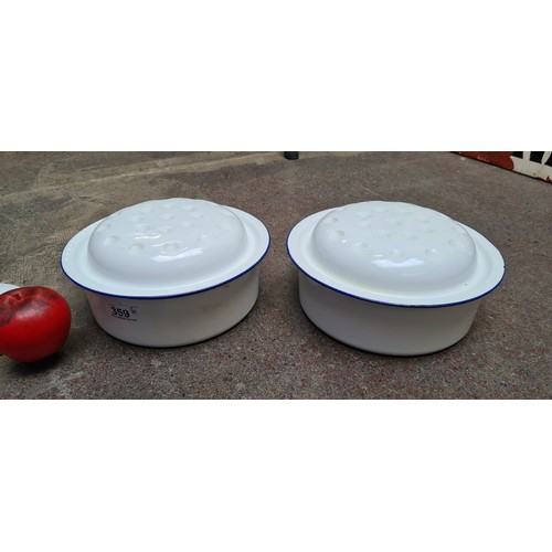 359 - A pair of vintage enamel lidded dishes in a blue and white finish.