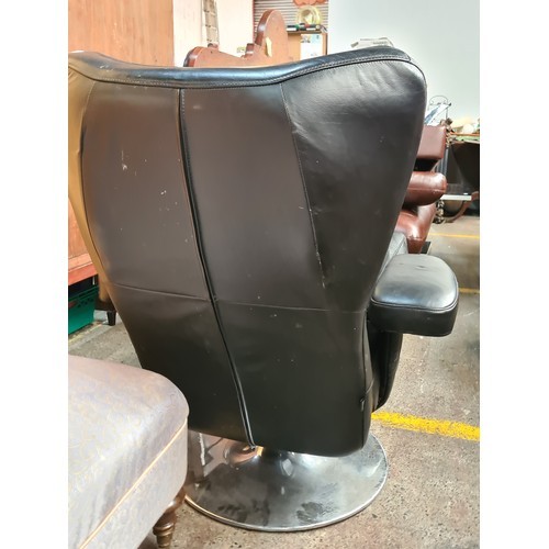 994 - Star Lot : A super stylish soft black Italian leather high wing recliner chair with armrests, chrome... 