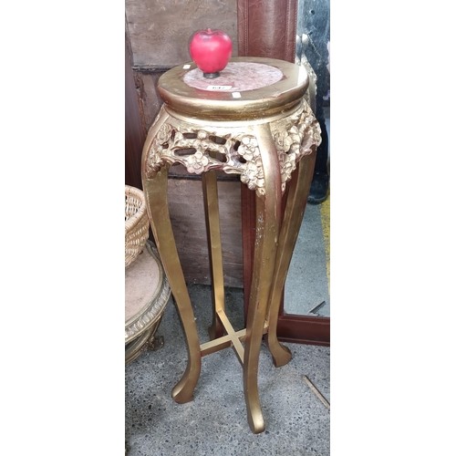 997 - Star Lot : A Baroque style plant stand with gilt finish and pink marble top. Very handsome piece.