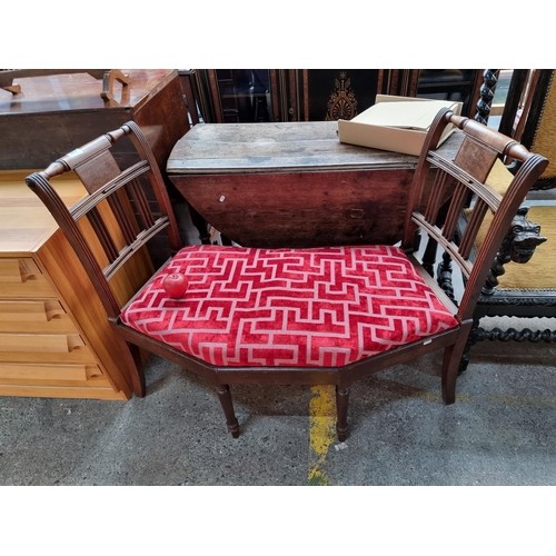 1011 - Star Lot : A gorgeous 19th Century conversation seat finished in a red velvet geometrical pattern. A... 