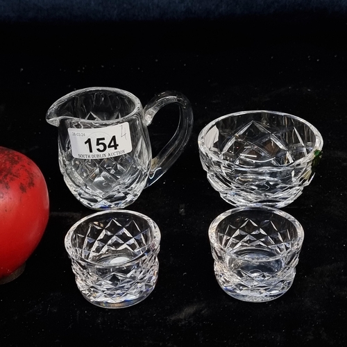 154 - Four stunning Waterford Crystal pieces including a Sugar and milk  jug and two salts. . All in good ... 