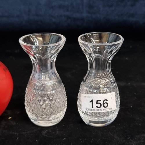 156 - A pair of gorgeous Waterford Crystal bud vases. In good condition with acid marks to base.