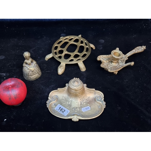 162 - Four vintage brass items including a fun tortoise trivet, Art Nouveau ink well, Chamber candle stick... 