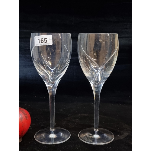 165 - A pair of Waterford Crystal wine glasses in a contemporary design with acid mark to base.