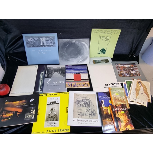 A large selection of art themed books and postcards. Including "Notorious Alfred Hitchcock and Contemporary Art".