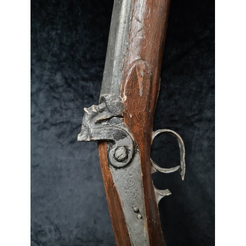 A vintage wooden replica of a flintlock musket.