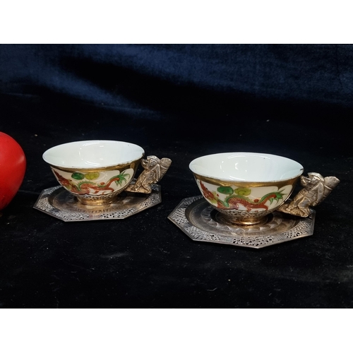 154 - Star Lot : A pair of early 20th century, Chinese export European Silver tea cups and saucers With 12... 