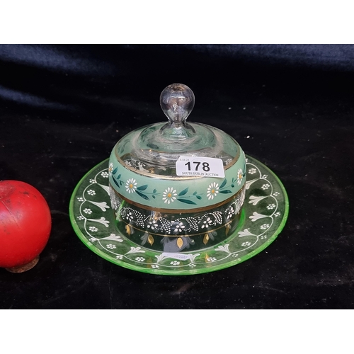 178 - A pretty antique art glass hand painted butter /preserve dome featuring moriage floral motif, in ver... 