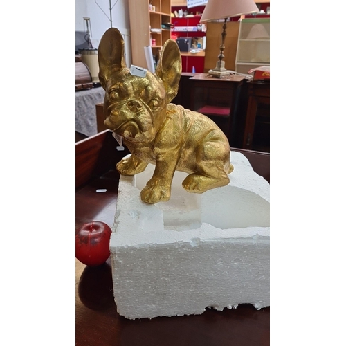 A brand new Golden-hued sculpture of a French Bulldog, a striking decorative piece.