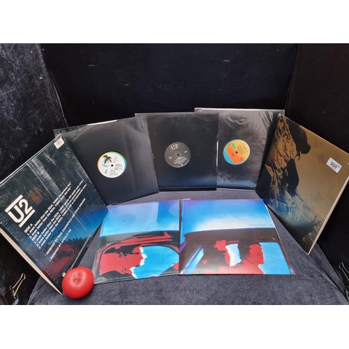 908 - Seven vintage U2 vinyl 12