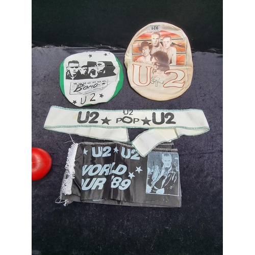 921 - Four pieces of early original U2 memorabilia including two unusual flat caps.