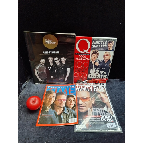 923 - Four collectible U2 themed magazines. Including a copy of Vanity Fair and Time magazine.