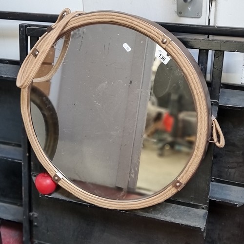 136 - A fabulous contemporary circular wall hanging mirror of brushed metal and rope bound construction.