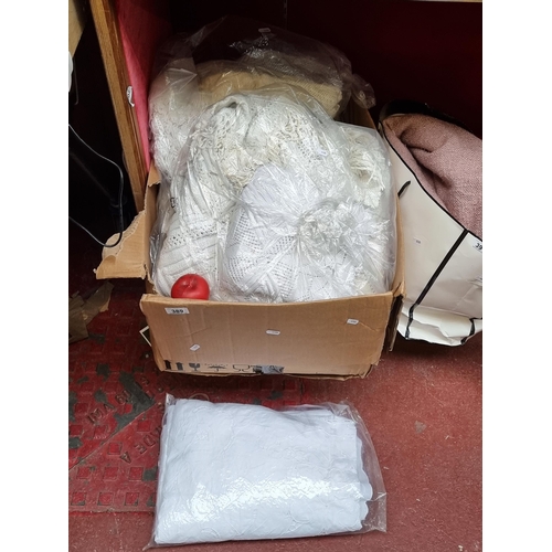 389 - A large box containing a large quantity of Irish Linen table clothes, textiles etc  All from the fab... 