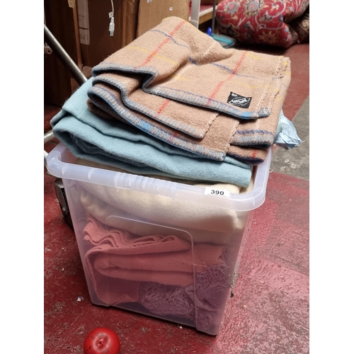 390 - A large box containing a nice selection of high quality heavy vintage mostly Irish woolen blankets i... 