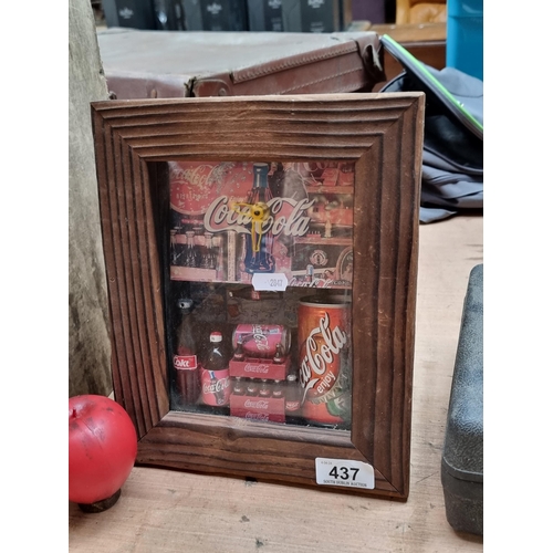 437 - A vintage shadow box Coca Cola clock featuring miniature bottles and cans.