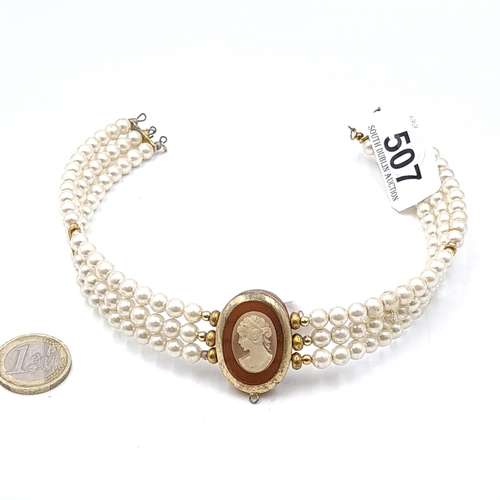 507 - An attractive cameo and three-row pearl choker necklace. Length - 32 cms.