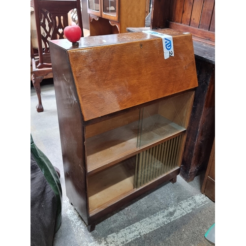 1107 - A handsome mid century bureau featuring glass front and two shelving units.