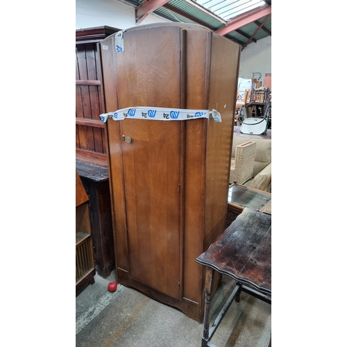 1108 - An elegant tall 1930s wardrobe with internal top shelf and additional clothes rail.