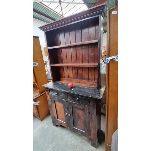 1109 - A gorgeous early 20th century kitchen dresser featuring two neatly sized cupboards along with two ad... 