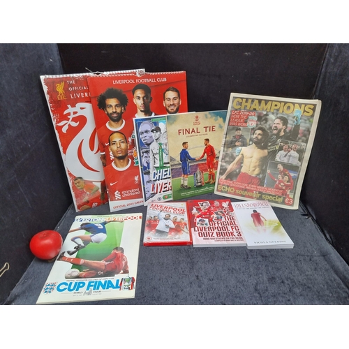 949 - A bag containing a collection of Liverpool FC memorabilia including calendars, DVD and books.