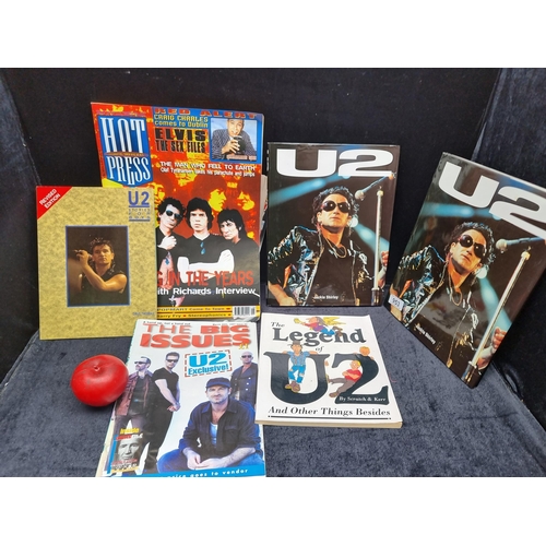 953 - An interesting collection of U2 memorabilia media including books and concert pads.