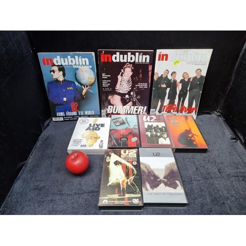 958 - A collection of U2 memorabilia including DVDS  magazines and VHS tapes.