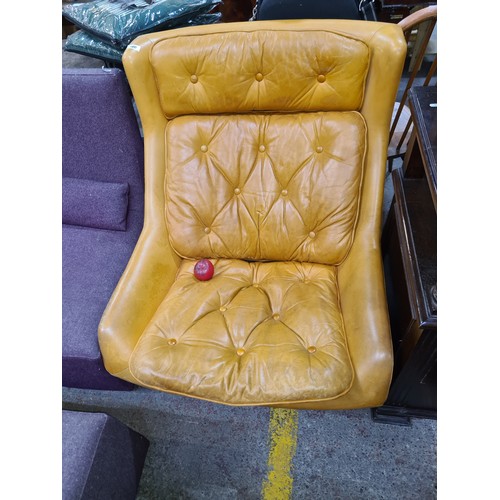 500 - Star Lot : A very comfortable Mid Century, Peem armchair Circa 1970s with wide leather  button back ... 