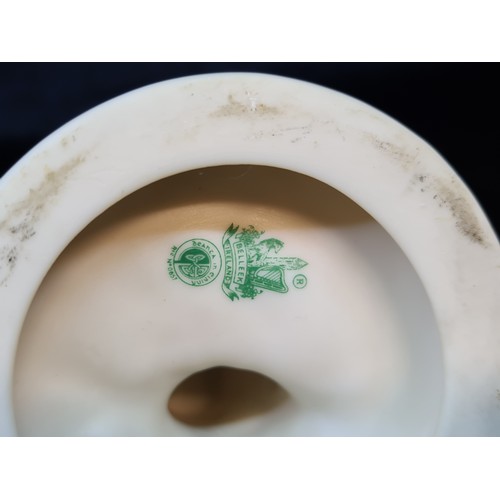 180 - Two stunning mid century green stamp Belleek figurine candle holders depicting a young boy and girl ... 