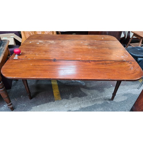 488 - A fabulous early 20th century drop leaf table featuring turned wood tapered legs. From a Dublin conv... 