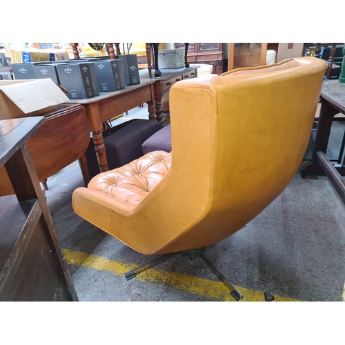 500 - Star Lot : A very comfortable Mid Century, Peem armchair Circa 1970s with wide leather  button back ... 