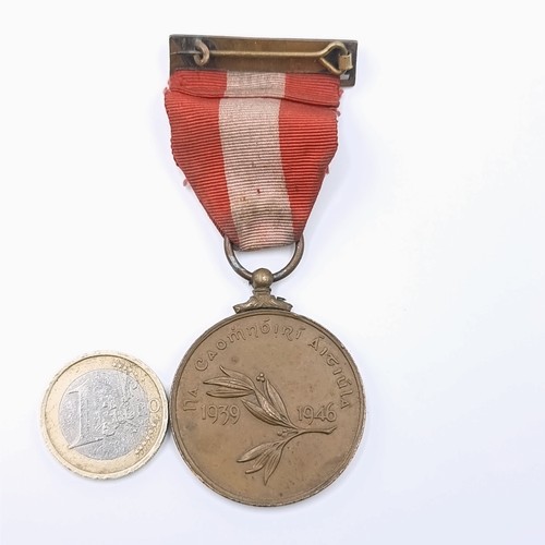 509 - An Irish Emergency war medal 1939-1946. Ribbon and pin intact. NA CAOMNOIRI For The regional Police ... 