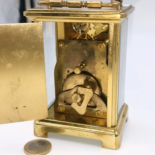 513 - Star Lot : A pretty French brass mechanical  carriage clock. Maker - Bayard, Paris . With white enam... 