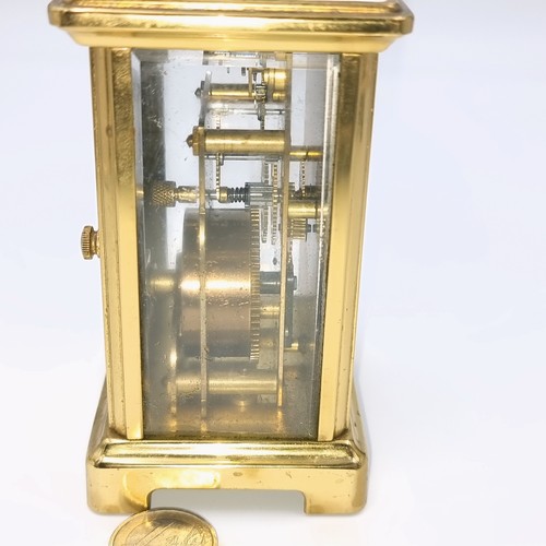 513 - Star Lot : A pretty French brass mechanical  carriage clock. Maker - Bayard, Paris . With white enam... 