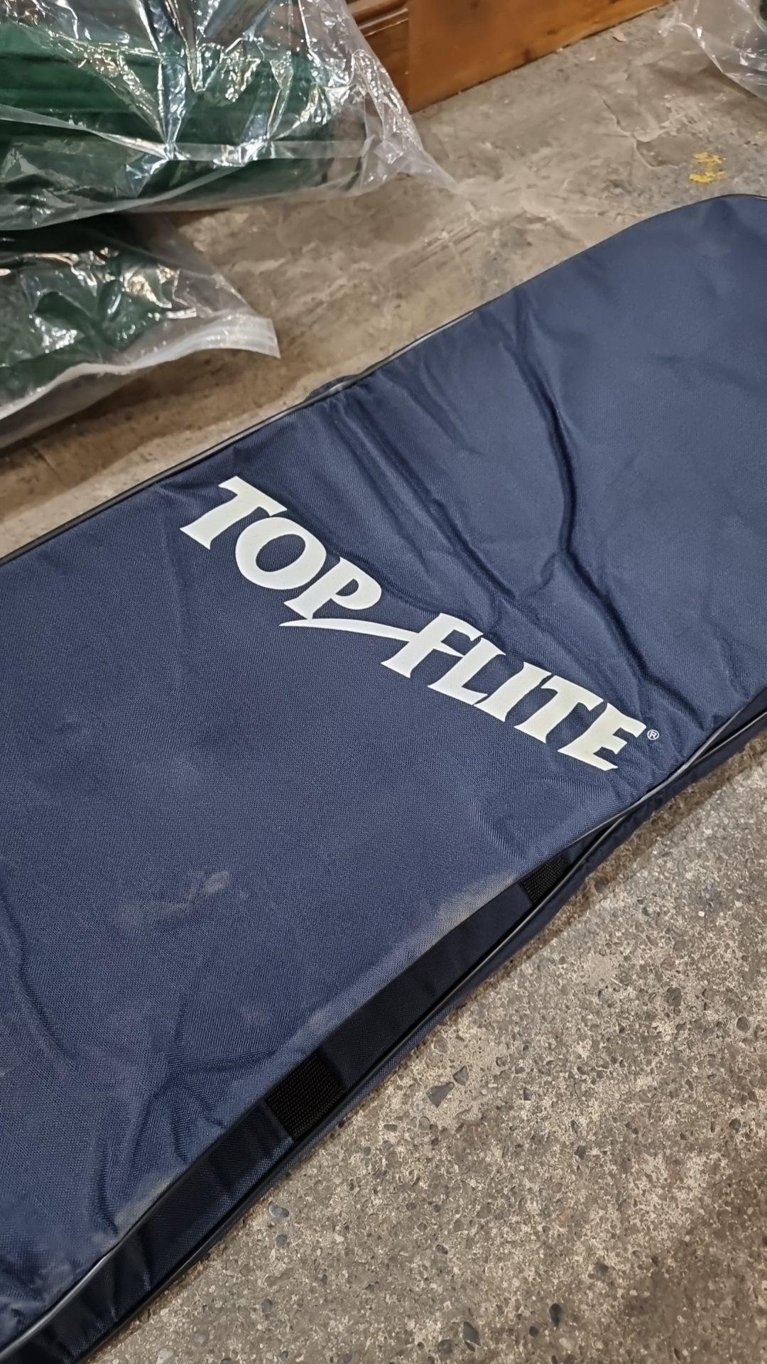A 'Top Flite' golf bag travel cover, navy blue, with padded top for