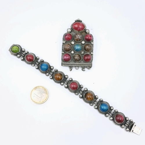 24 - Two interesting examples of vintage jewellery consisting of an eight panel Cabachon stone bracelet. ... 
