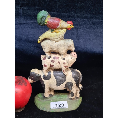 129 - A charming hobby cast metal door stop in the form of stacked farm animals.