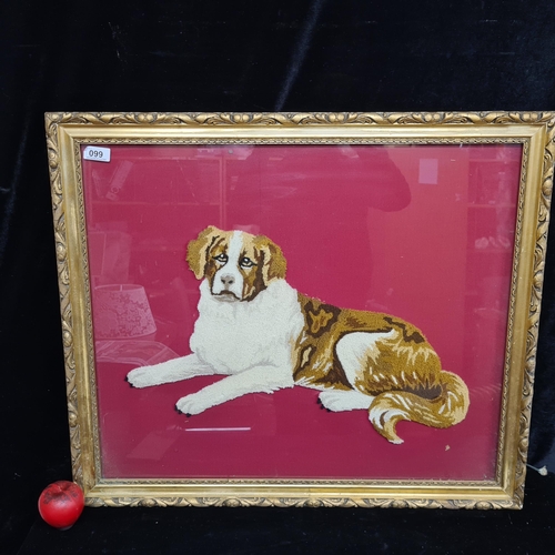 99 - A large handcrafted needle point tufted dog portrait. Features a loyal St. Bernard dog against a che... 