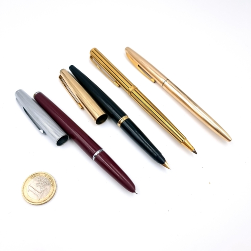 50 - A collection of four pens consisting of a Watermans fountain pen and a ballpoint pen together with a... 
