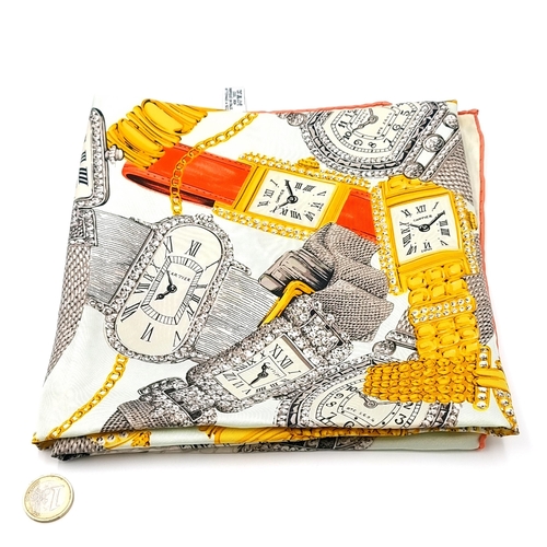 411 - Star Lot : A Cartier silk scarf depicting the companies various watch designs with rolled stitched e... 