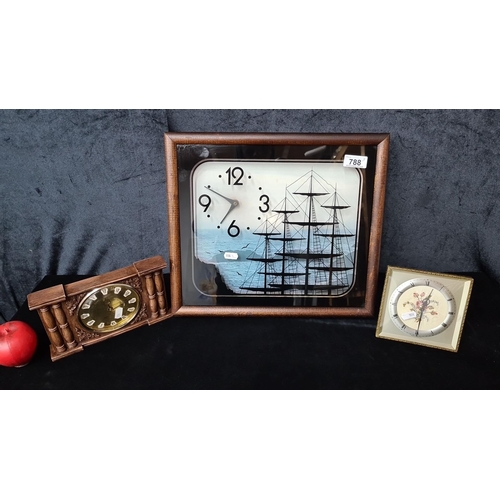 788 - A Trio of decorative clocks, including a ship-themed wall clock, a floral miniature clock, and a cla... 