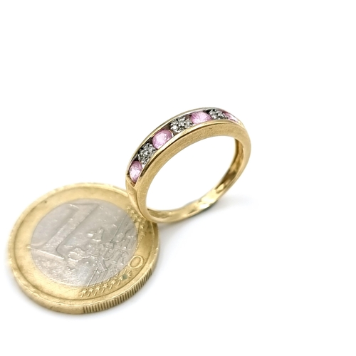 1129 - Star Lot : A beautiful pink spinel and diamond ring set in a 9k (375) gold band. Ring size N. Weight... 