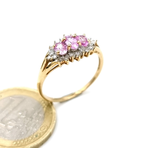 1139 - Star Lot : A sparkling 9K (375) ruby and diamond gold ring. Ring size S. Weight 2.15g.