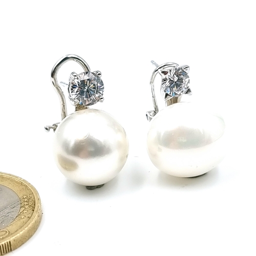 1148 - A pretty pair of sterling silver Baroque pearls. Weight 10.77g. Suitable for pierced ears.