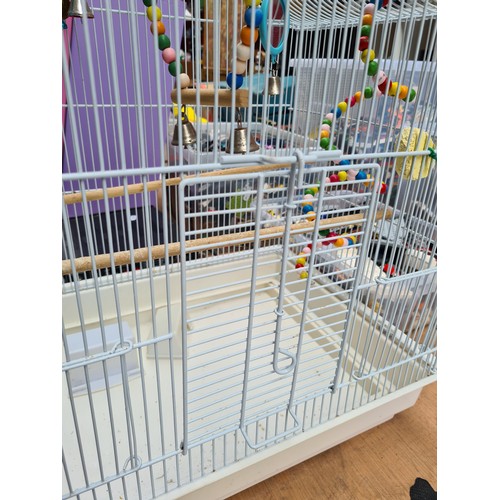 393 - A superb white bird cage with playful accessories included. Comes with hanging stand.